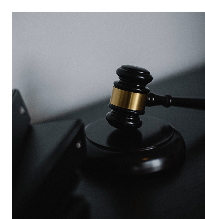 A judge 's gavel sitting on top of a table.